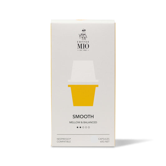 A box of MIO Smooth mellow balanced coffee capsules, with a yellow cup on the front, indicating 10 capsules and compatibility with Nespresso machines.